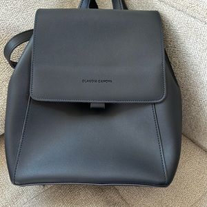 Claudia Canova backpack. Dark blue exterior and purple suede interior